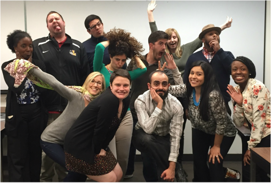 Picture of 12 individuals striking silly poses at the conclusion of a semester's class.