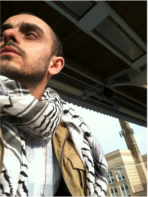 Picture of T.J. with keffiyeh at train station